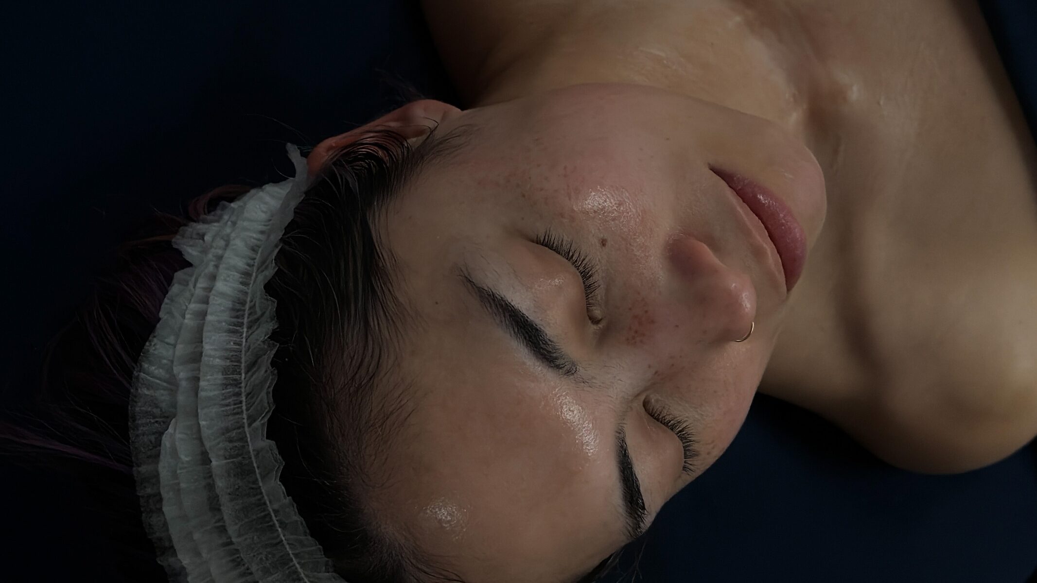Client receiving a custom facial at Blu Monarch Skin Studio in San Mateo